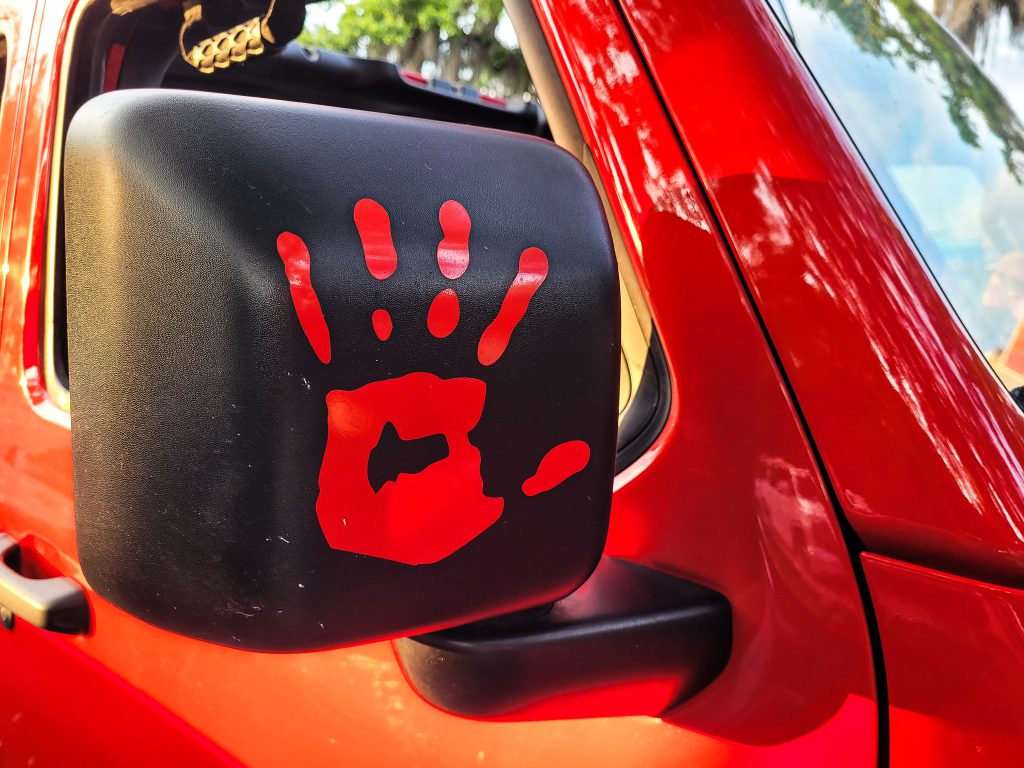 hand-signal-on-side-view-mirror-on-a-truck-2026-03-24-04-59-39-utc
